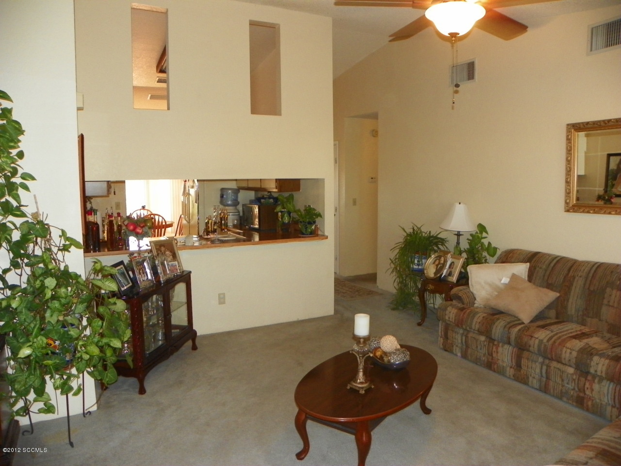 1103 Erie Court Rio Rico, AZ 85648 - Photo 12 of 16 a living room with furniture and a potted plant