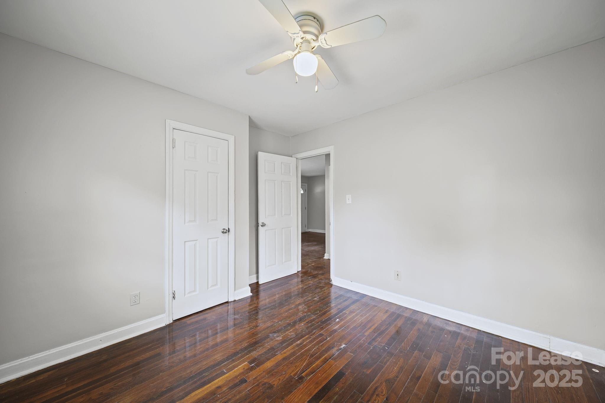 2621 Druid Hls Way, Unit 4 Charlotte, NC 28206 - Photo 22 of 35 a view of an empty room with wooden floor