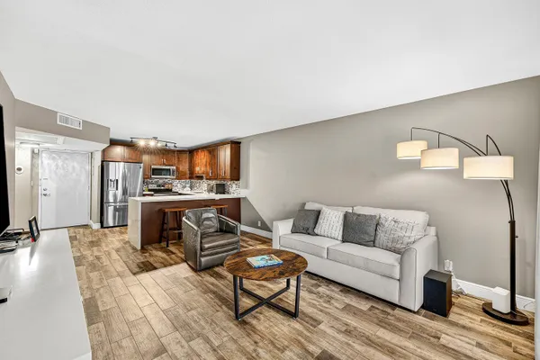 a living room with furniture and a rug