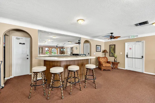 a living room with furniture a dining table and chairs