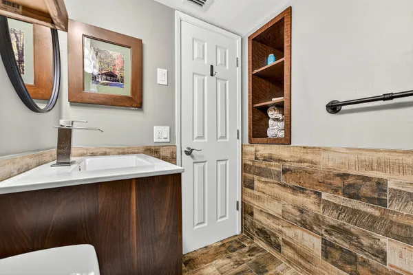 a bathroom with a sink and a mirror