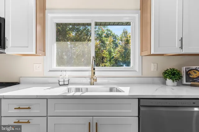 a bathroom with a sink and a window