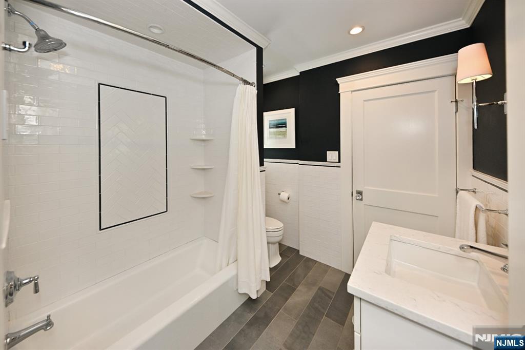18 Tonawanda Road Glen Rock, NJ 07452 - Photo 20 of 37 a bathroom with a sink a toilet and shower