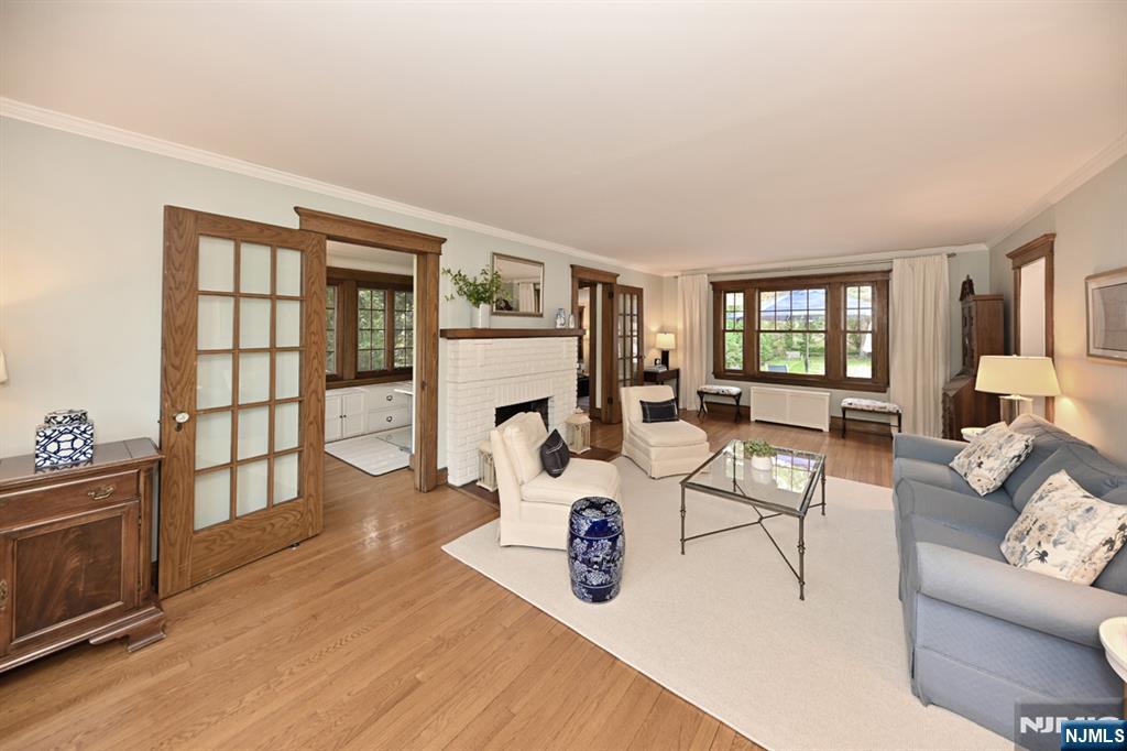 18 Tonawanda Road Glen Rock, NJ 07452 - Photo 4 of 37 a living room with furniture a fireplace and a table