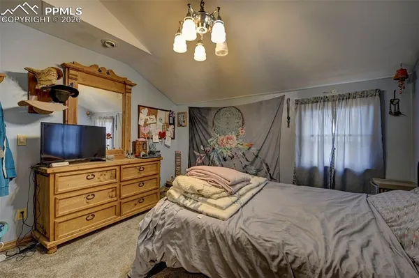 a bed room with a bed and a couch