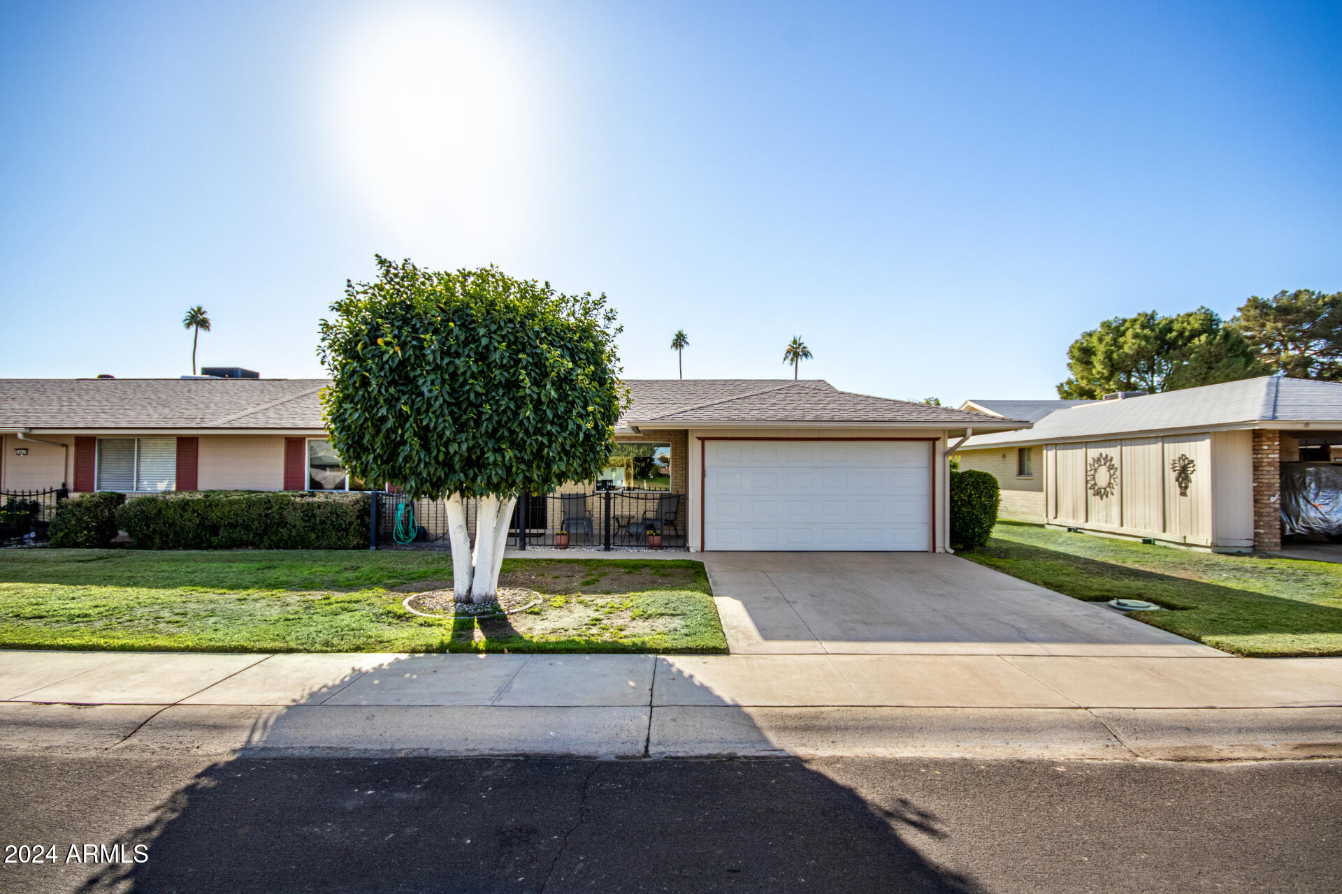 10819 West Hatcher Road Sun City, AZ 85351 - Photo 2 of 51 02 Front