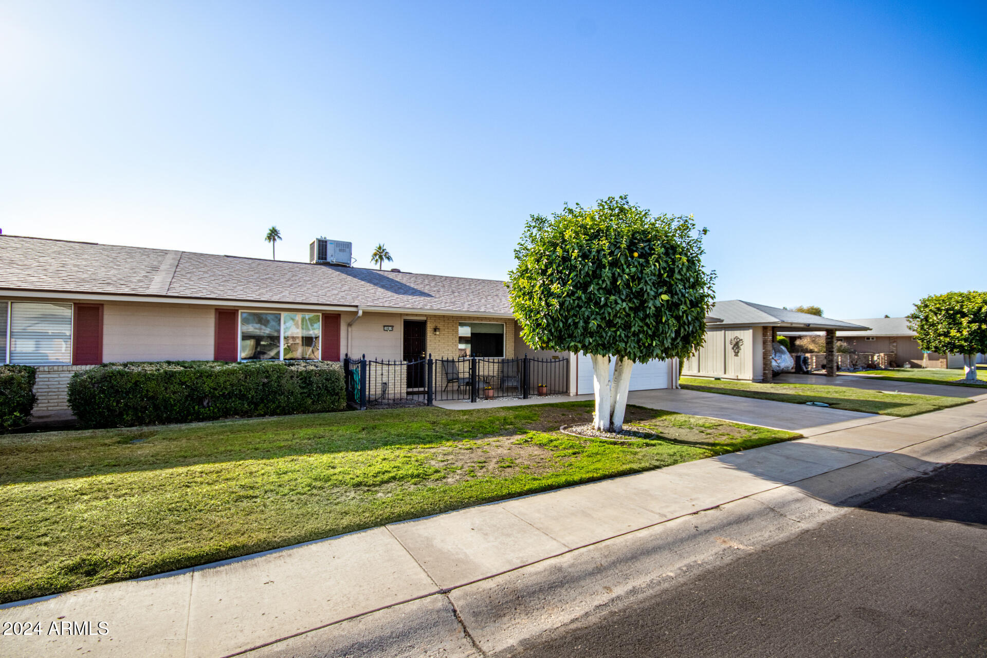 10819 West Hatcher Road Sun City, AZ 85351 - Photo 3 of 51 03 Front