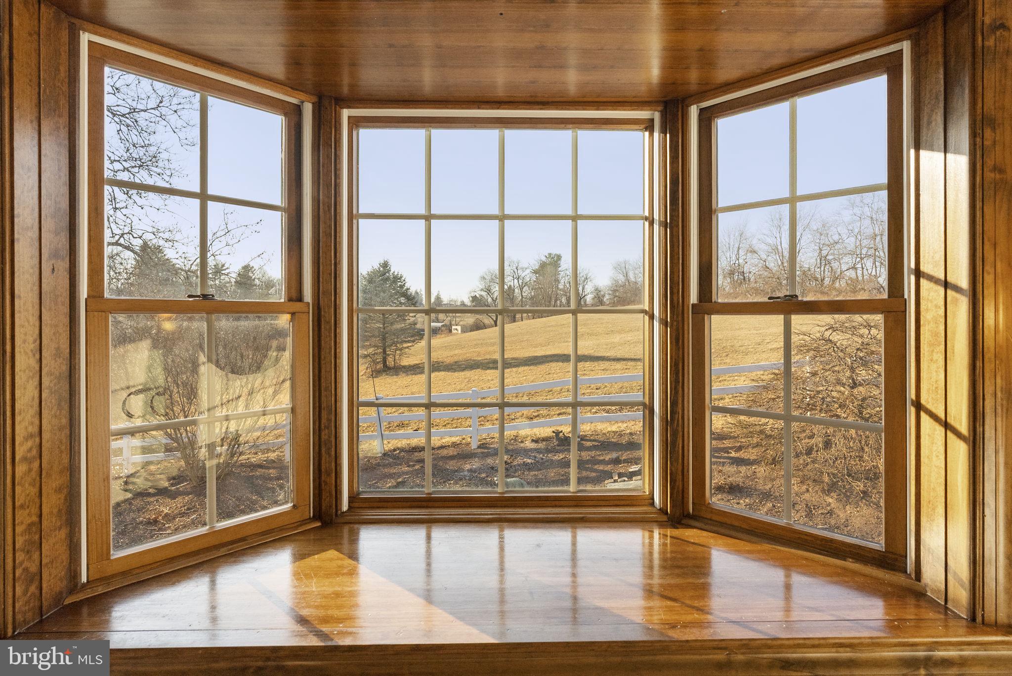 185 Spring Hollow Road Spring City, PA 19475 - Photo 17 of 33 a view of empty room with wooden floor and floor to ceiling window