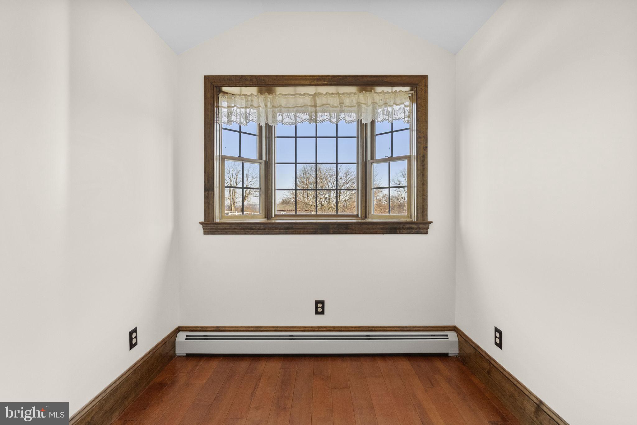 185 Spring Hollow Road Spring City, PA 19475 - Photo 20 of 33 a view of a room with wooden floor and a window