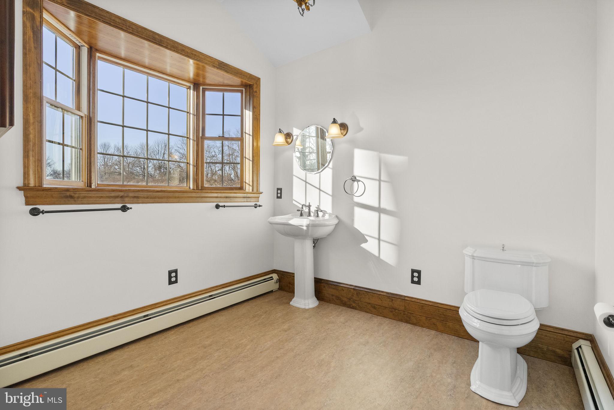185 Spring Hollow Road Spring City, PA 19475 - Photo 21 of 33 a bathroom with a toilet and a window
