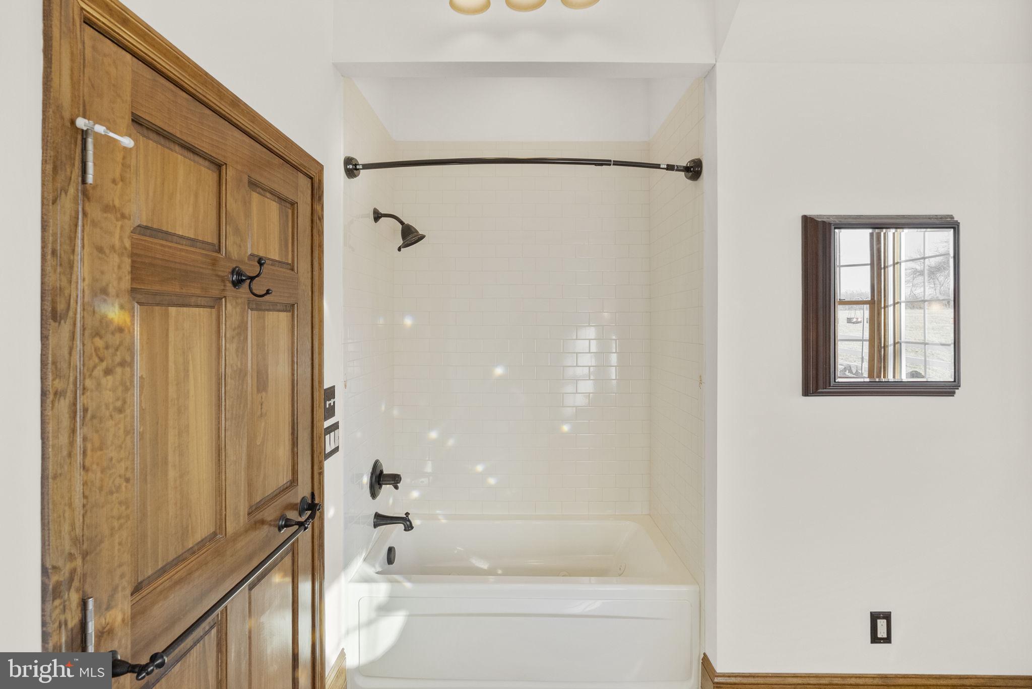 185 Spring Hollow Road Spring City, PA 19475 - Photo 22 of 33 a bathroom with a bathtub and a shower