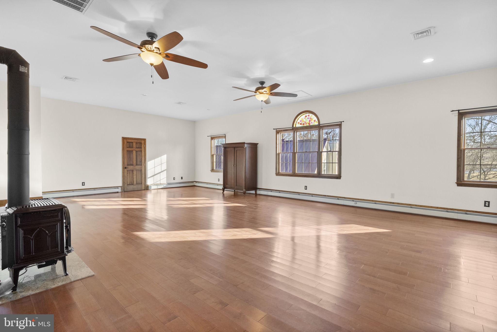 185 Spring Hollow Road Spring City, PA 19475 - Photo 6 of 33 a view of a livingroom with a window and wooden floor