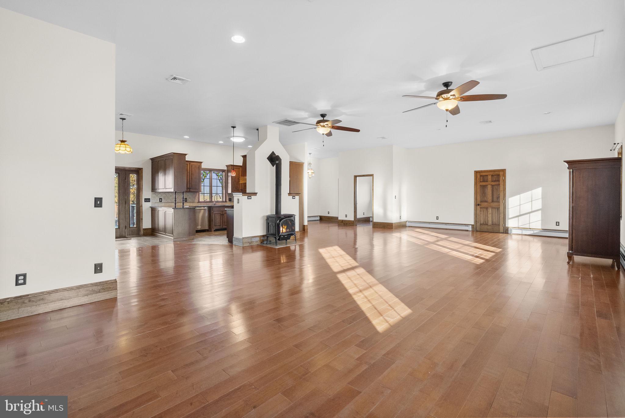 185 Spring Hollow Road Spring City, PA 19475 - Photo 8 of 33 a view of a living room a kitchen view and a fireplace