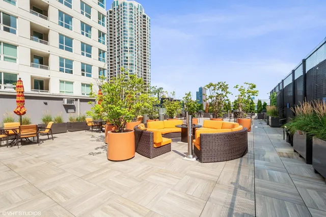 a view of building with potted plants