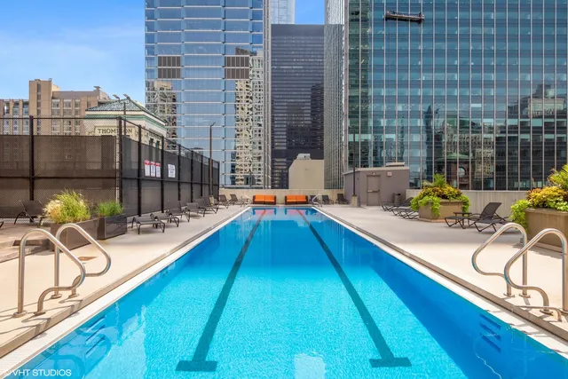 a view of a swimming pool with a lounge chairs