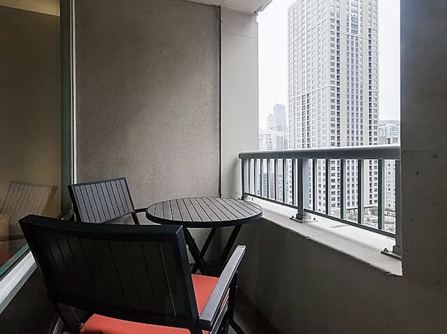 345 North LaSalle Drive, Unit 2505 Chicago, IL 60654 - Photo 9 of 16 a view of a balcony with chairs