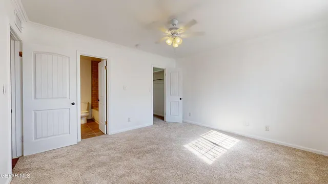 a view of a livingroom with a ceiling fan