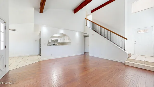 a view of an entryway with wooden floor