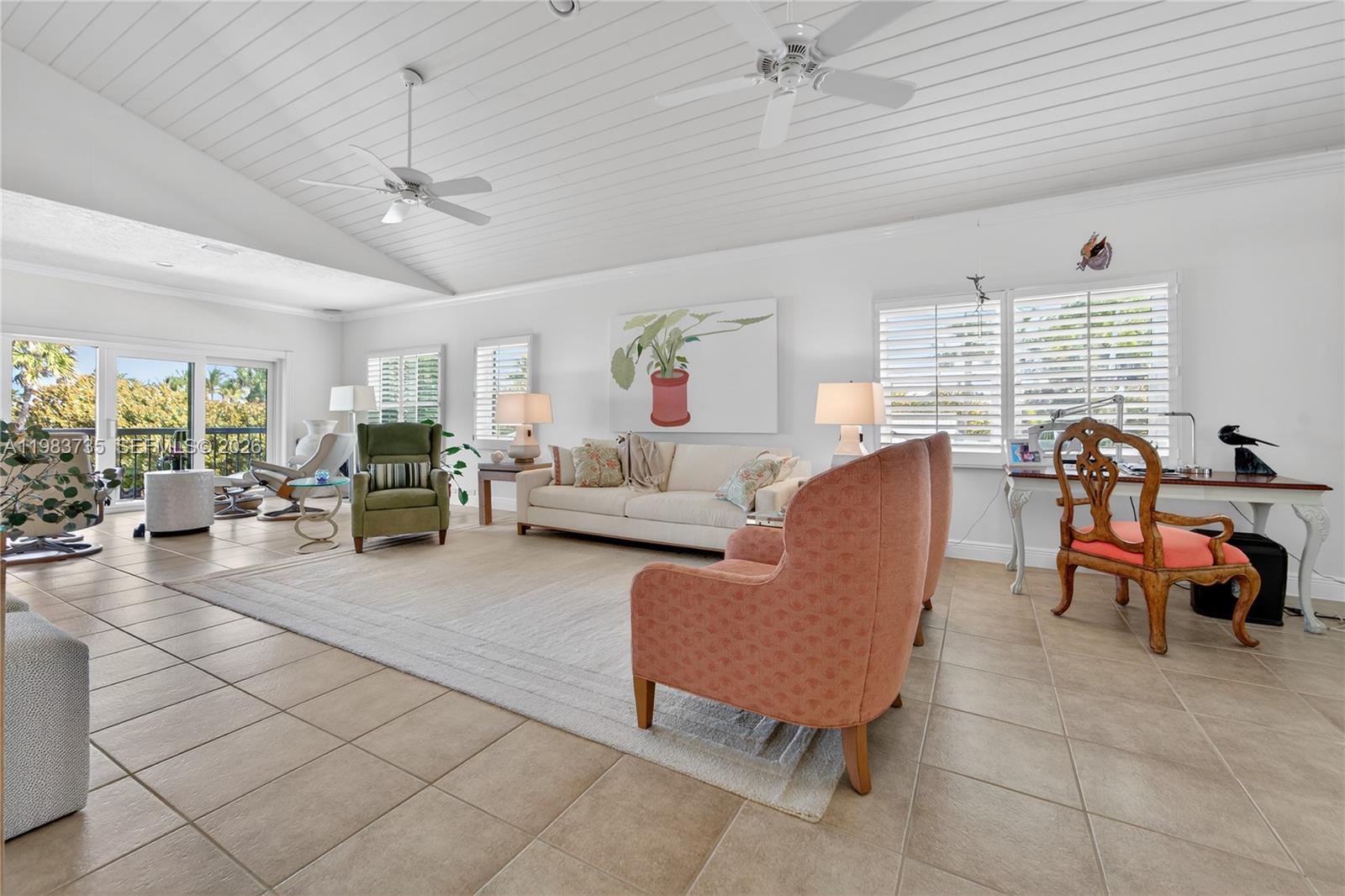 851 Saturn Street, Unit D Jupiter, FL 33477 - Photo 8 of 60 a living room with furniture and a large window