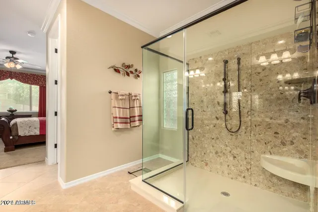 a bathroom with a glass shower door