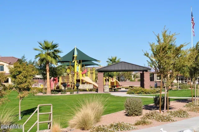 a view of a table and chairs under an umbrella
