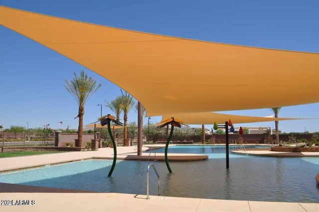 a view of swimming pool with outdoor seating