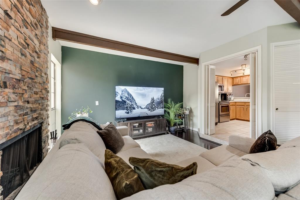 2652 Entrada Boulevard Irving, TX 75038 - Photo 11 of 28 a living room with furniture and a fireplace