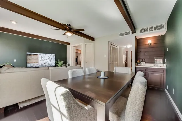 a view of kitchen and dining area with a sink