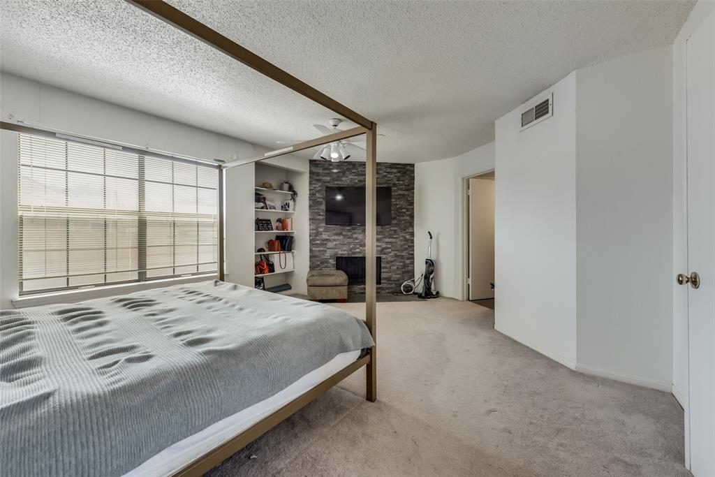 2652 Entrada Boulevard Irving, TX 75038 - Photo 17 of 28 a bed sitting in a spacious bedroom next to a window