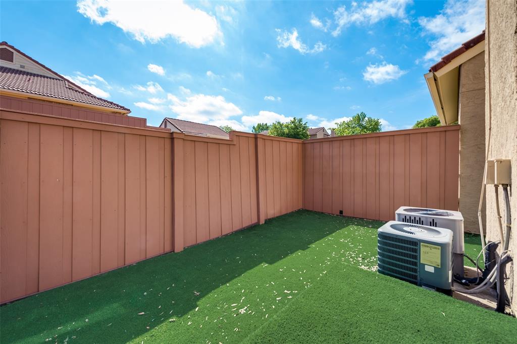 2652 Entrada Boulevard Irving, TX 75038 - Photo 20 of 28 a view of a backyard with wooden fence