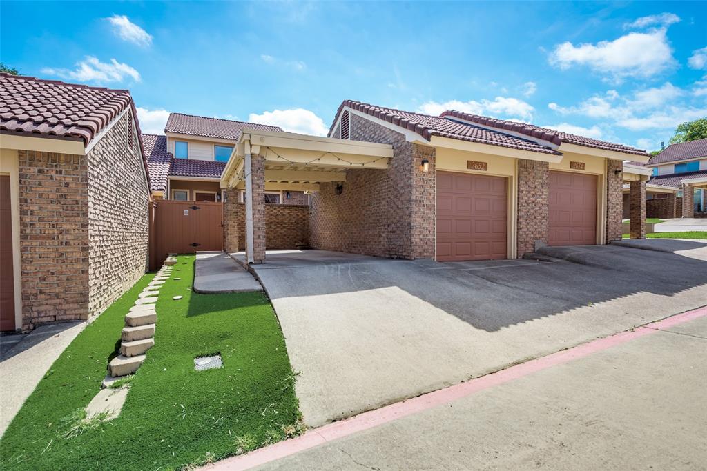 2652 Entrada Boulevard Irving, TX 75038 - Photo 2 of 28 a front view of a house with a yard