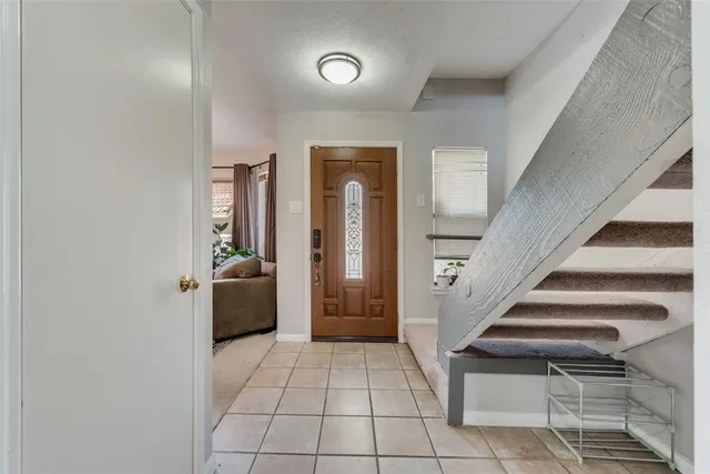 a view of an entryway with wooden floor