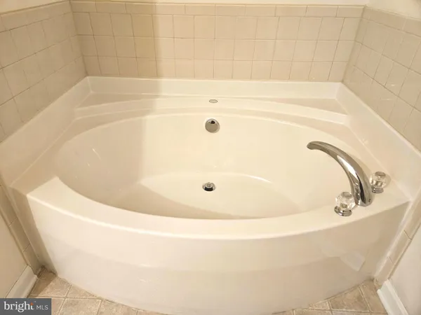 a white bath tub sitting in a bathroom