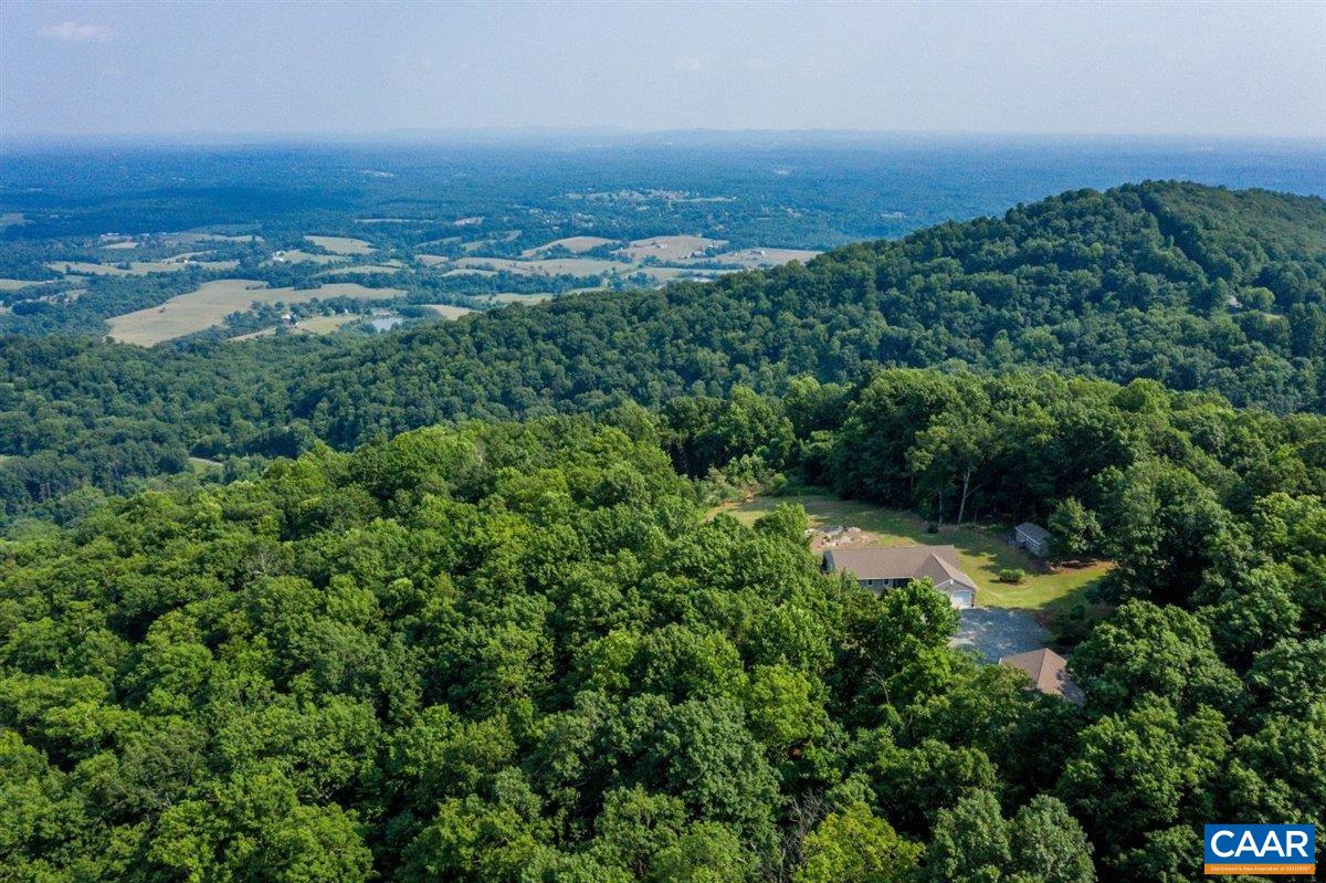 867 Hanging Rock Road Monroe, VA 24574 - Photo 54 of 67 an aerial view of residential houses with outdoor space and trees