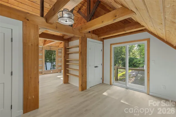 a view of a room with furniture and a window