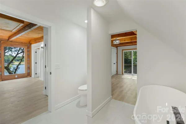 a view of living room kitchen with furniture and wooden floor