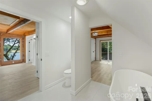 a view of living room kitchen with furniture and wooden floor