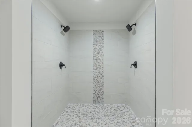 a view of a room with wooden floor and windows