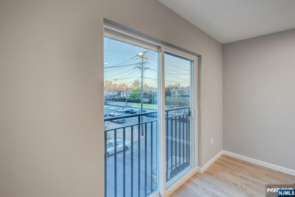 581 Bergen Street Newark, NJ 07108 - Photo 14 of 30 a view of a wooden floor and windows