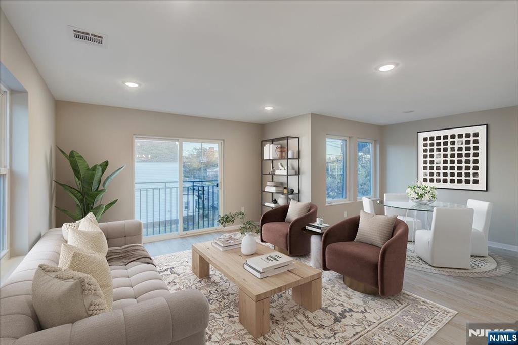 581 Bergen Street Newark, NJ 07108 - Photo 4 of 30 a living room with furniture and a large window