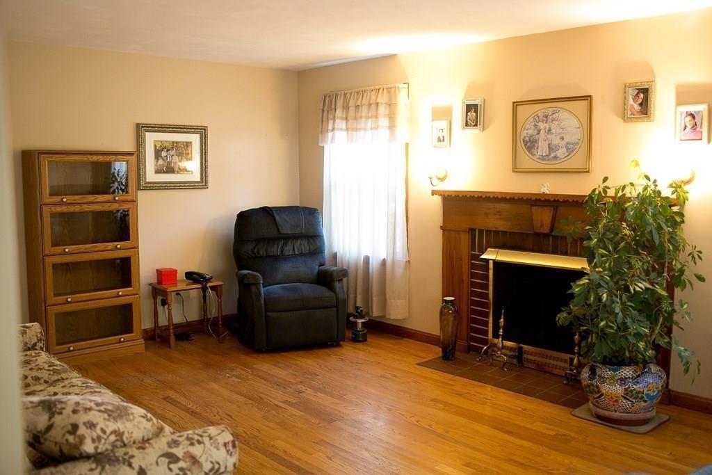 280 Harkness Avenue Springfield, MA 01118 - Photo 17 of 36 a living room with furniture and a fireplace