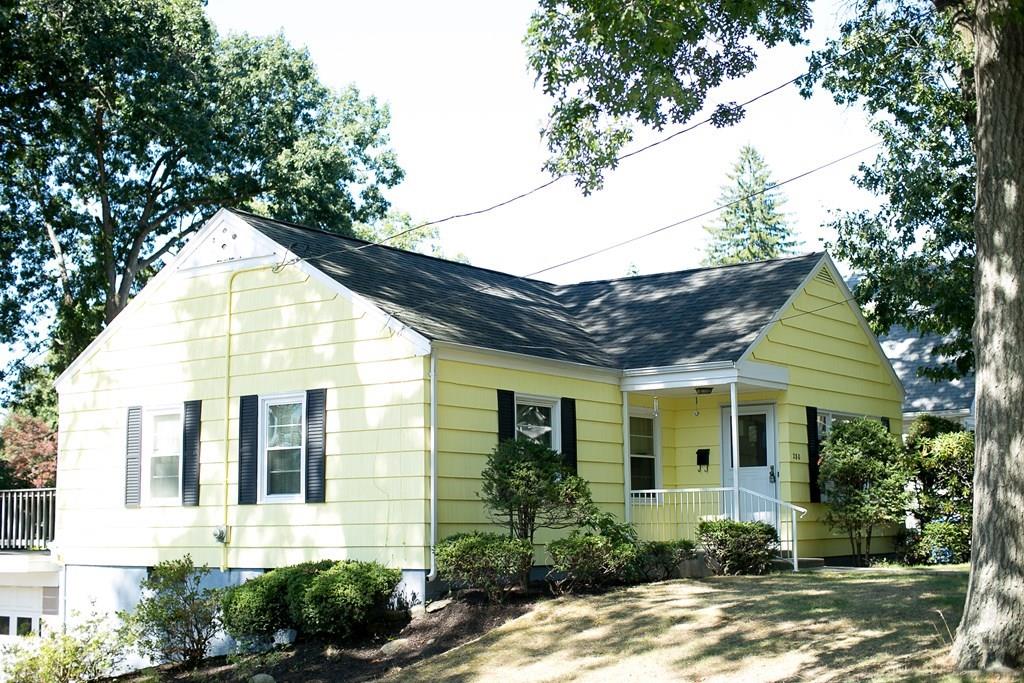280 Harkness Avenue Springfield, MA 01118 - Photo 2 of 36 a view of a house with brick walls plants and large tree