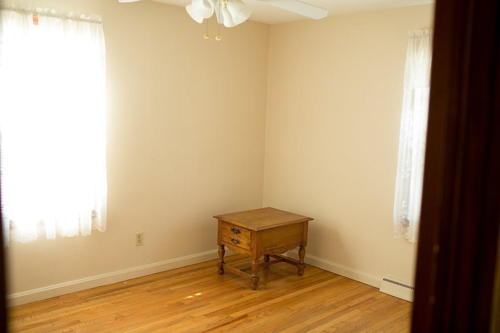 280 Harkness Avenue Springfield, MA 01118 - Photo 26 of 36 a room with a table and a chair