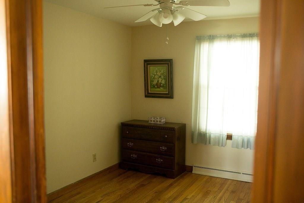 280 Harkness Avenue Springfield, MA 01118 - Photo 28 of 36 a view of a hallway with wooden floor
