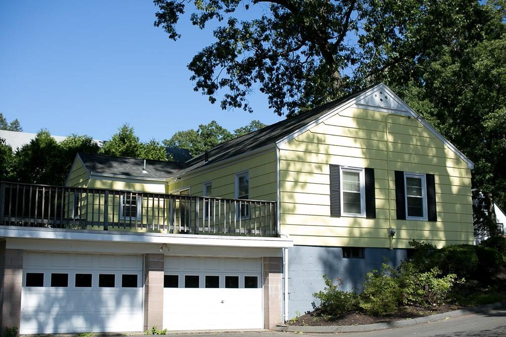 280 Harkness Avenue Springfield, MA 01118 - Photo 5 of 36 a front view of a house with a garden