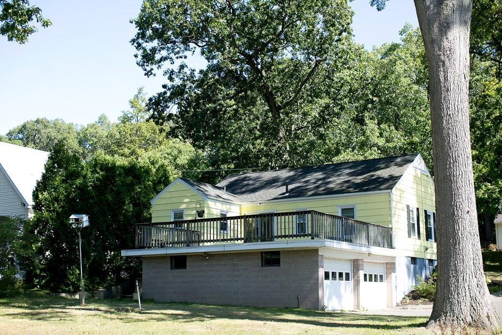 280 Harkness Avenue Springfield, MA 01118 - Photo 6 of 36 a front view of a house with a garden