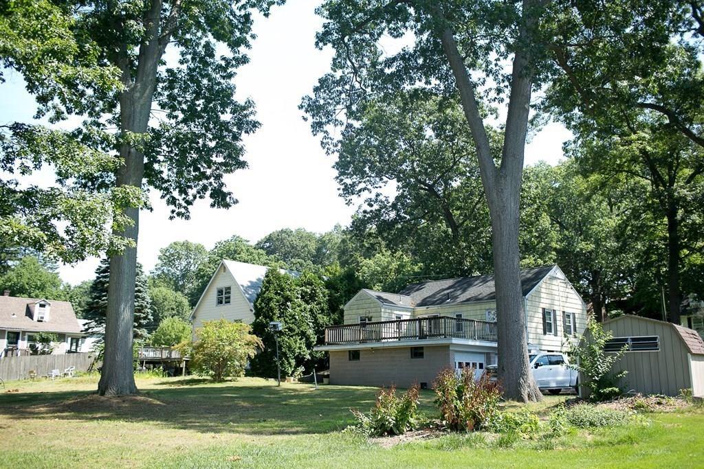 280 Harkness Avenue Springfield, MA 01118 - Photo 9 of 36 a front view of a house with a yard and a fountain
