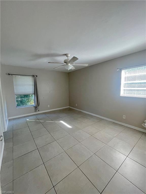 1756 52nd Terrace Southwest Naples, FL 34116 - Photo 11 of 18 a view of a livingroom with an empty space and a window