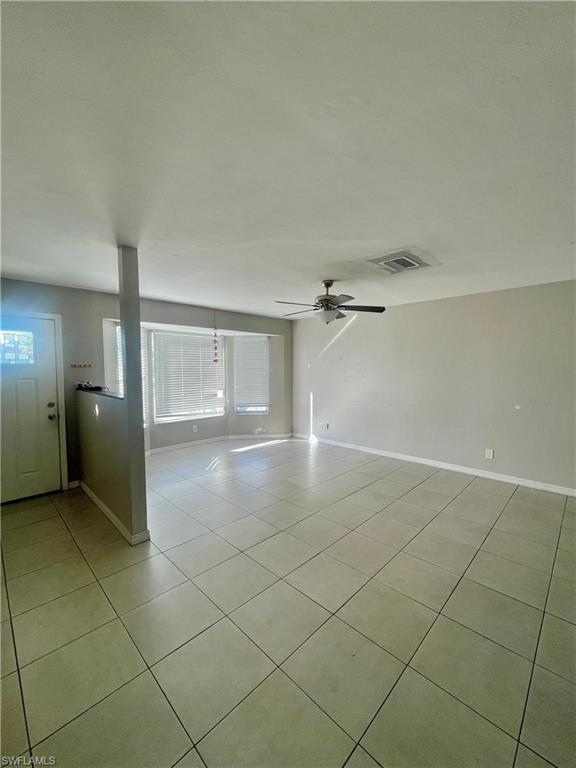 1756 52nd Terrace Southwest Naples, FL 34116 - Photo 4 of 18 a view of a livingroom and a bathroom