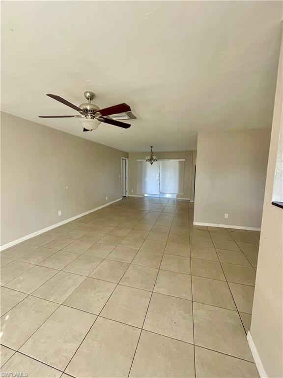 1756 52nd Terrace Southwest Naples, FL 34116 - Photo 5 of 18 a view of a livingroom with a carpet